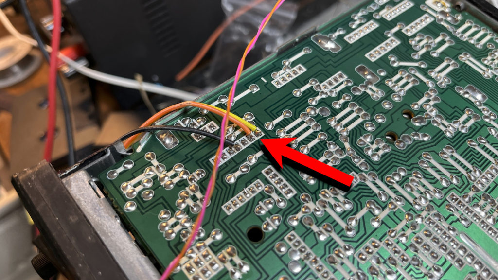 Photo of bottom of radio, circuit board exposed